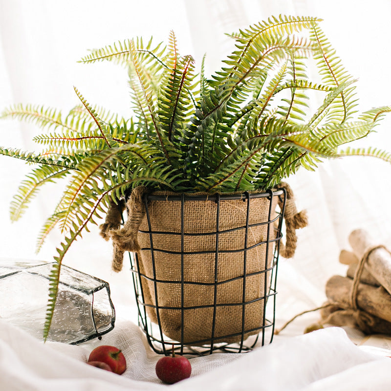 Decorative storage basket made of wire and linen