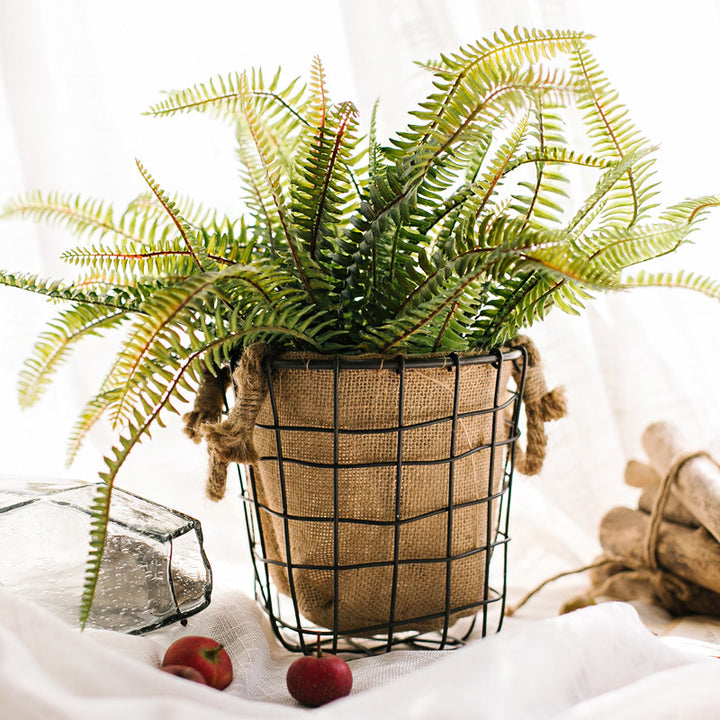 Decorative storage basket made of wire and linen