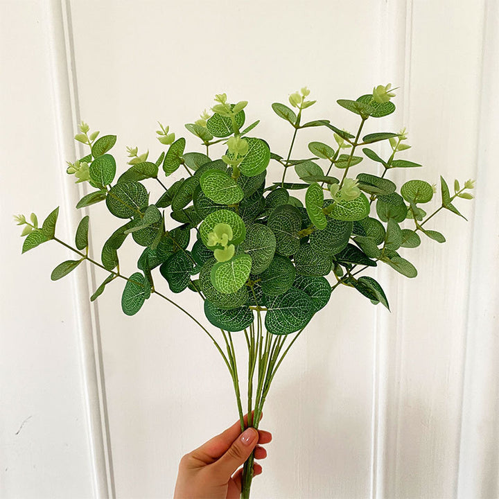 Artificial flowering branch with lifelike leaves and delicate flowers