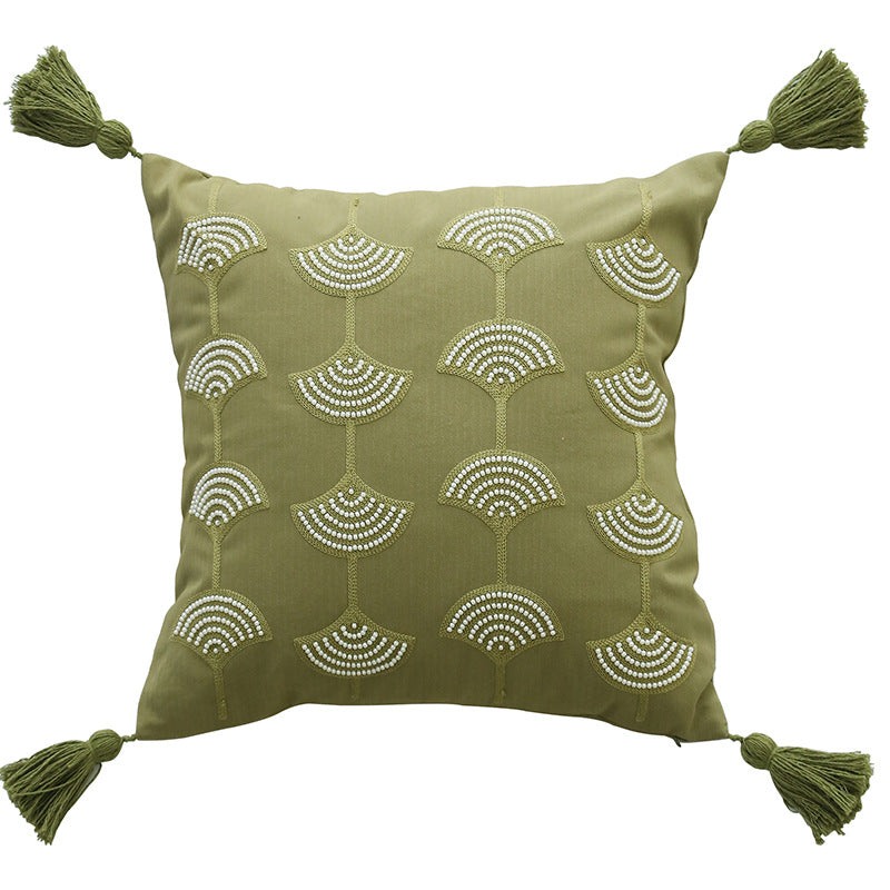 Square decorative pillow with embroidered fan motif and decorative tassels