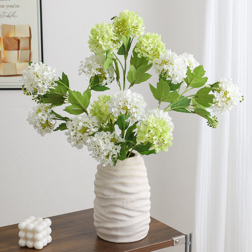 Artificial hydrangea branch with vibrant flowers and detailed leaves