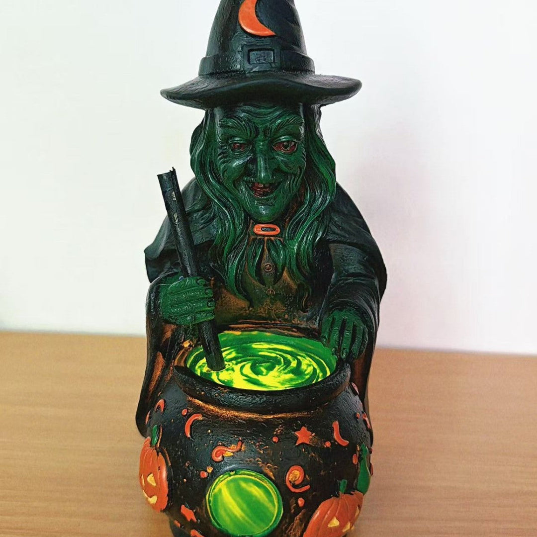 Decorative witch figure with cauldron