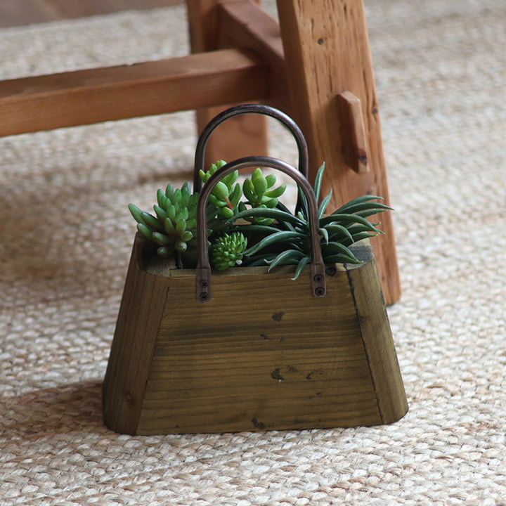 Handcrafted wooden basket with metal handles