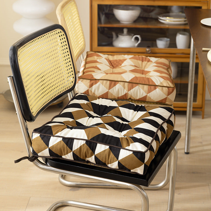 Padded chair cushion with ties and quilted tufted upholstery