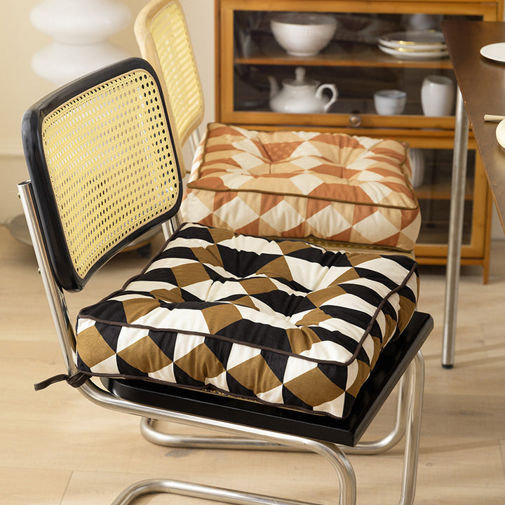 Padded chair cushion with ties and quilted tufted upholstery