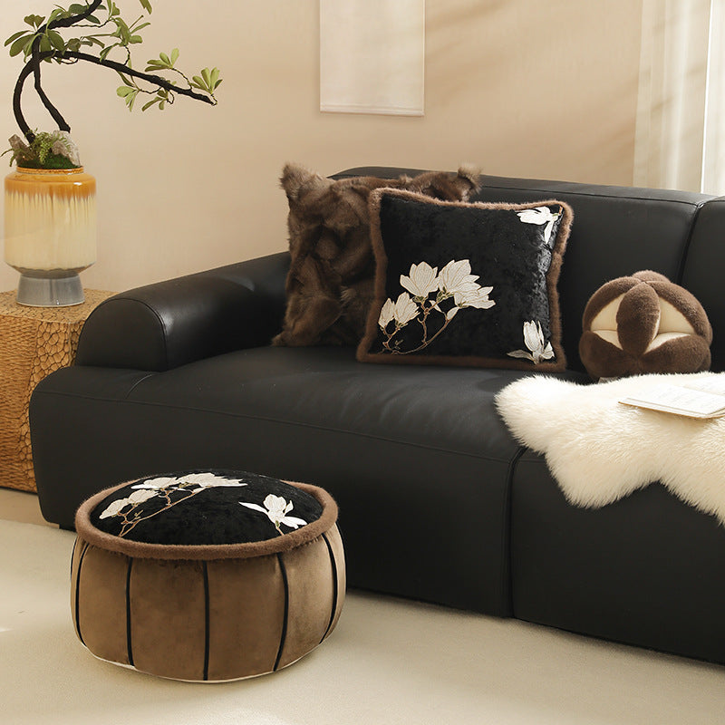 Square velvet decorative cushion with embroidered magnolia motif and faux fur border