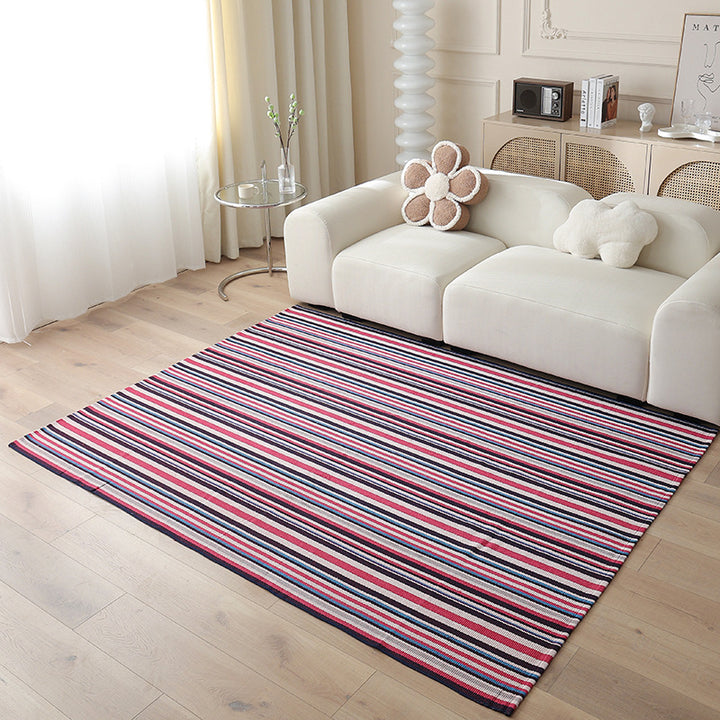 Woven living area rug with large check pattern and flat cotton texture