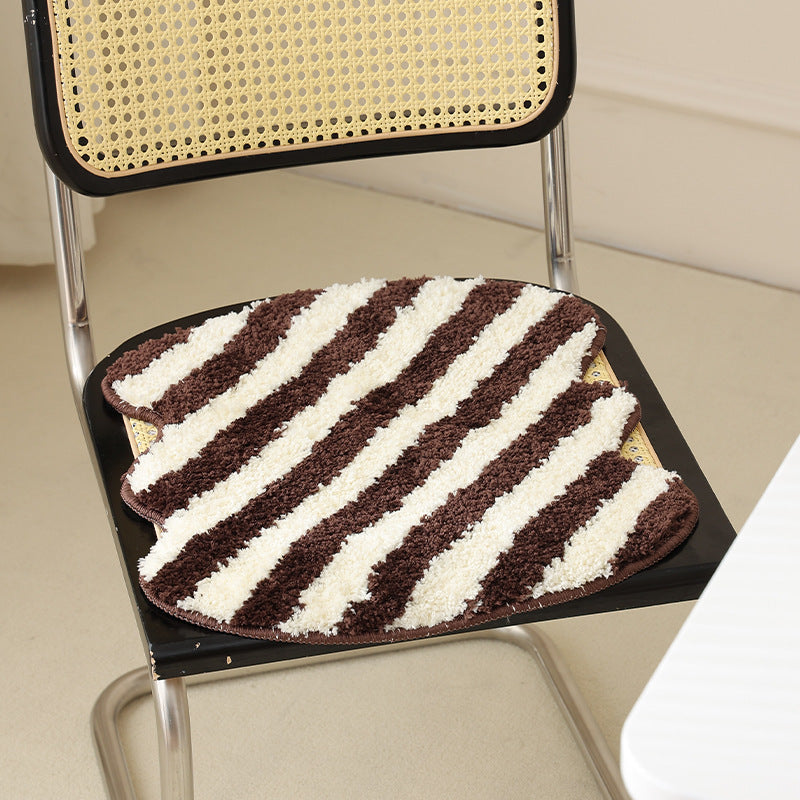 Shaped high pile bath mat with diagonal stripe structure