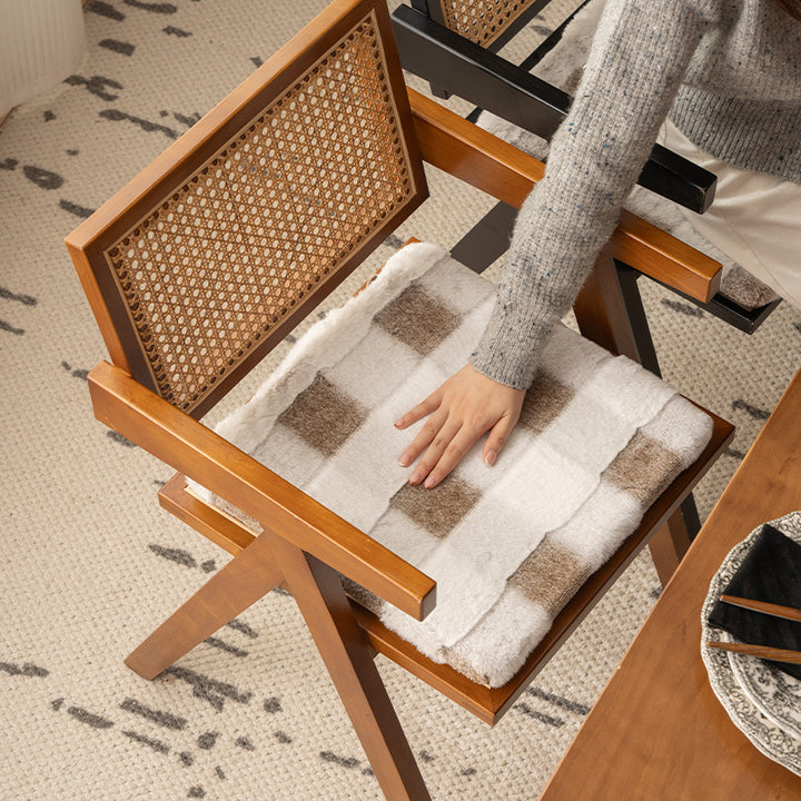 Padded seat cushion with faux fur cover and fastening straps