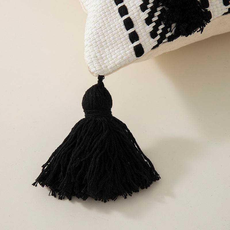 Handwoven decorative cushion cover made of cotton blend with tassels and structured stripe look