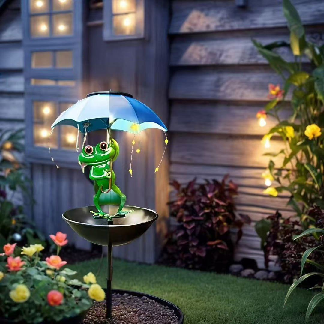 Decorative garden birdhouse stake with protective umbrella and playful frog decoration