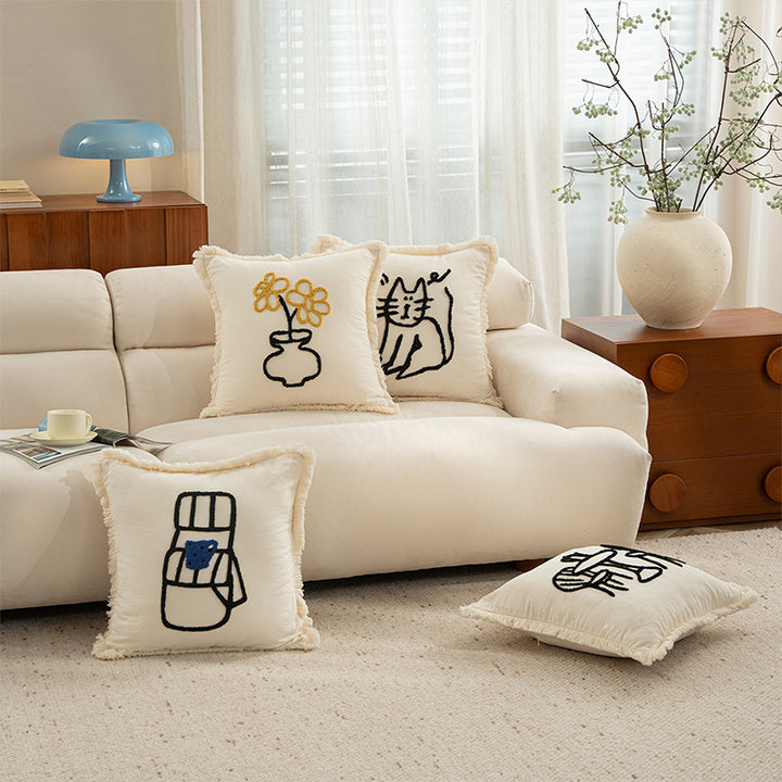Decorative pillowcase with embroidered café motif, fringed edge, and concealed zipper