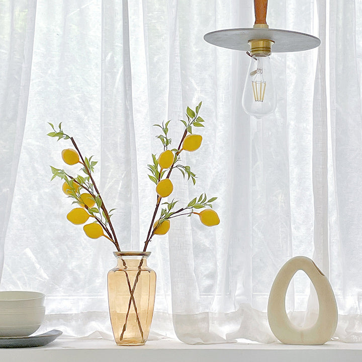 Decorative branch with artificial lemons
