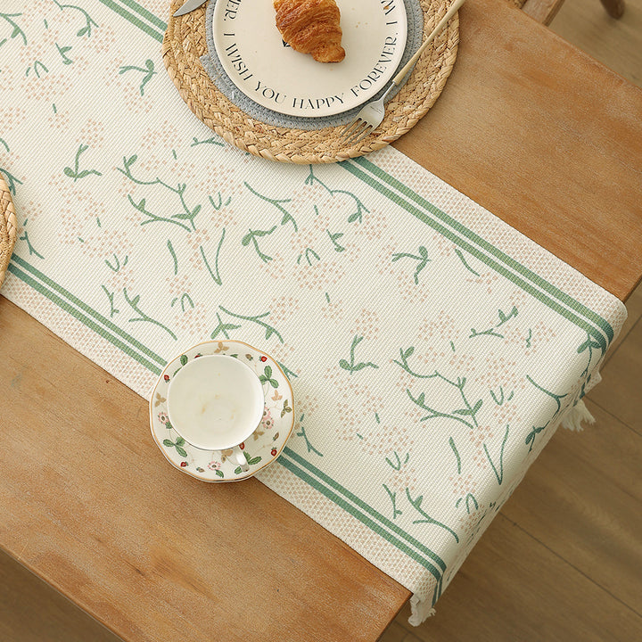 decorative table runner made of woven cotton with tassels