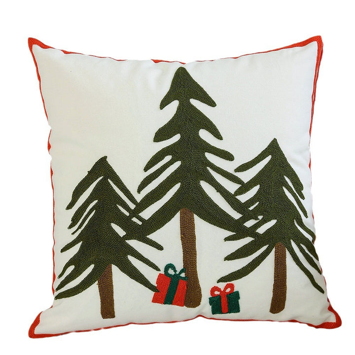 Decorative cushion cover with festive Christmas star print and pom-pom trim