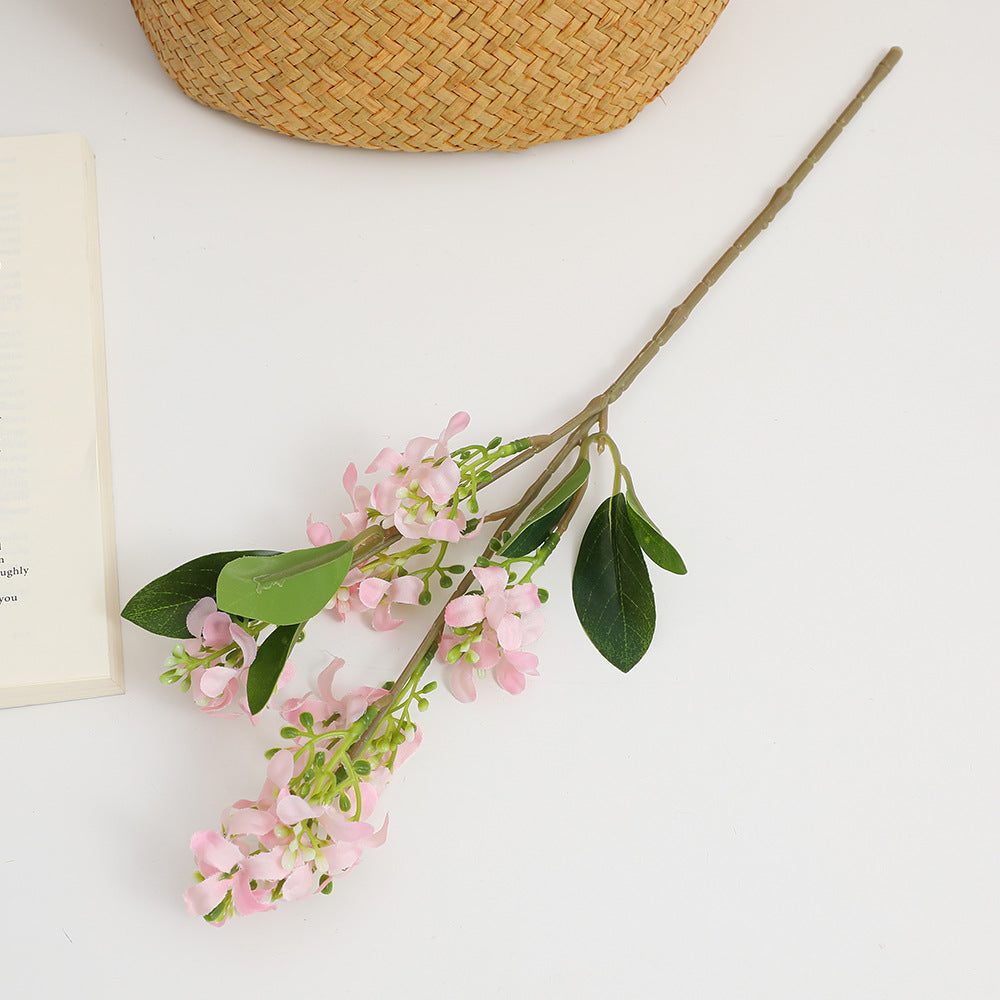 Artificial flower branch with bright flowers