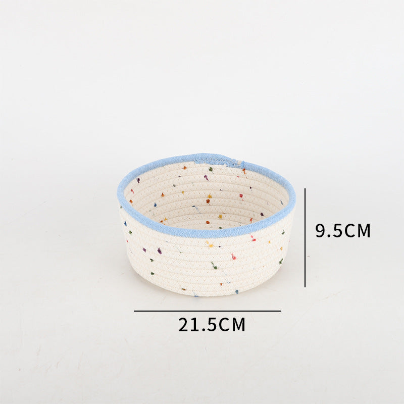 Storage basket made of natural cotton fabric with colorful dots