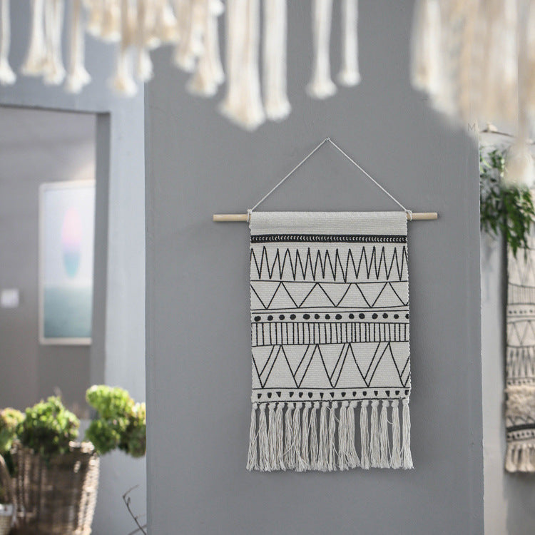 Woven Boho wall hanging with fringes and graphic ethnic pattern