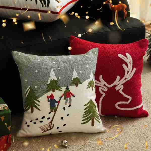 Decorative cushion cover with festive Christmas star print and pom-pom trim