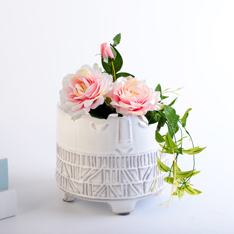 Decorative plant pot with facial features