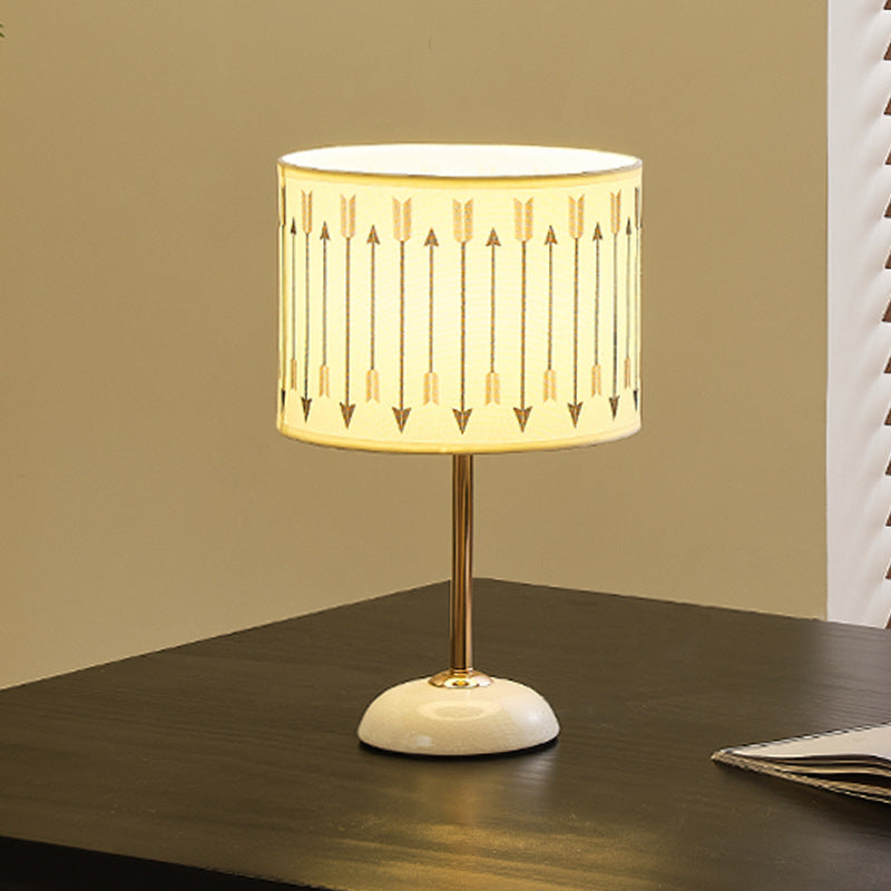 Ceramic base bedside lamp with fabric shade in arrow pattern