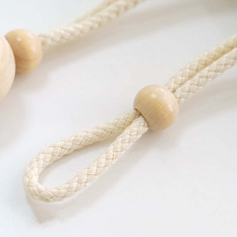 Elegant curtain holder with wooden beads