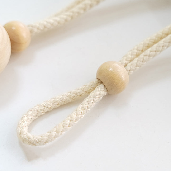 Elegant curtain holder with wooden beads