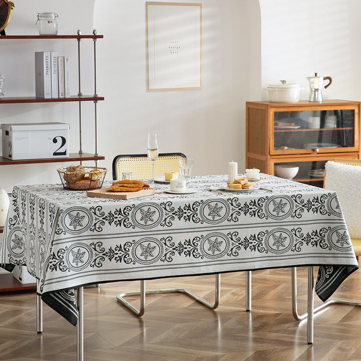 Reversible jacquard tablecloth with floral medallion reliefs
