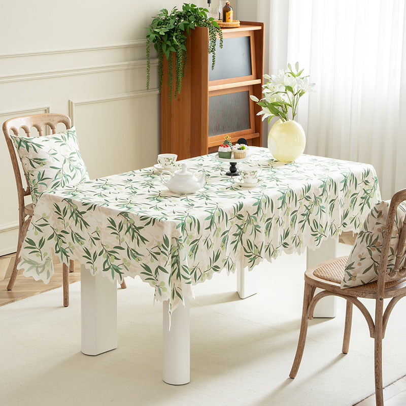 Round wipeable tablecloth with floral cut-out hem