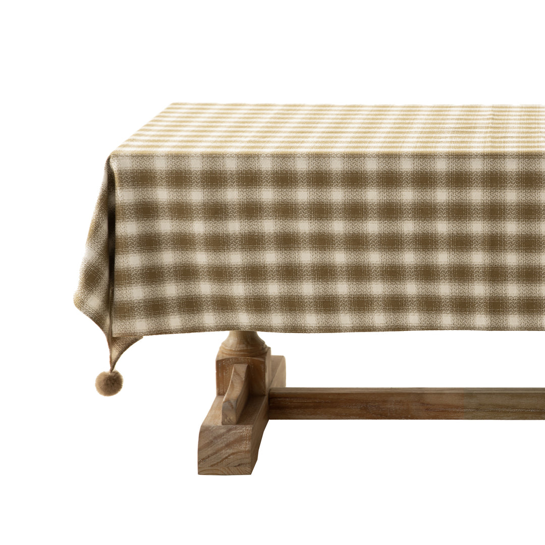 Square tablecloth made of cotton blend fabric with checkered weave pattern and pom-pom corners