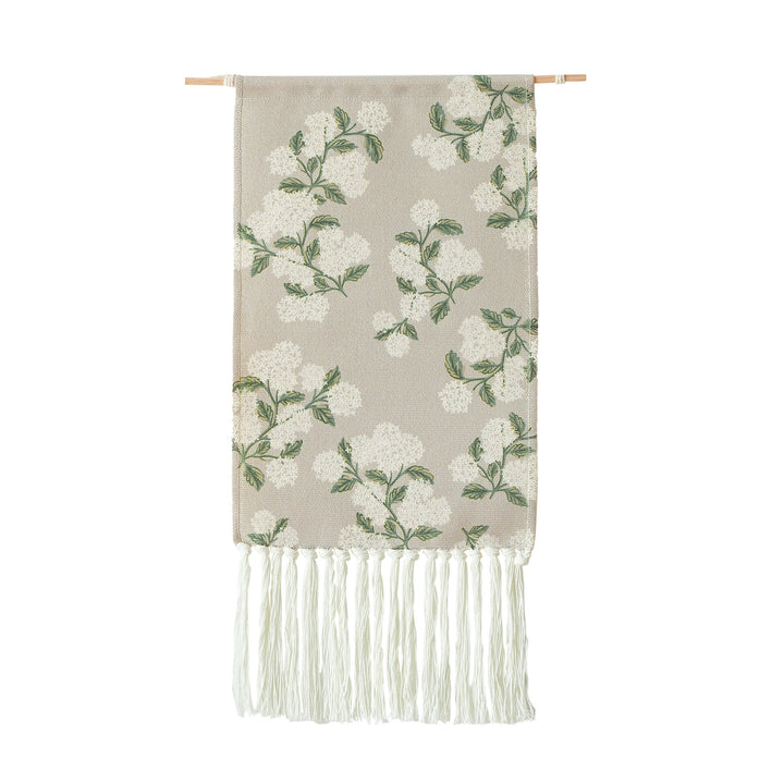 Woven wall hanging with floral jacquard structure and long fringes