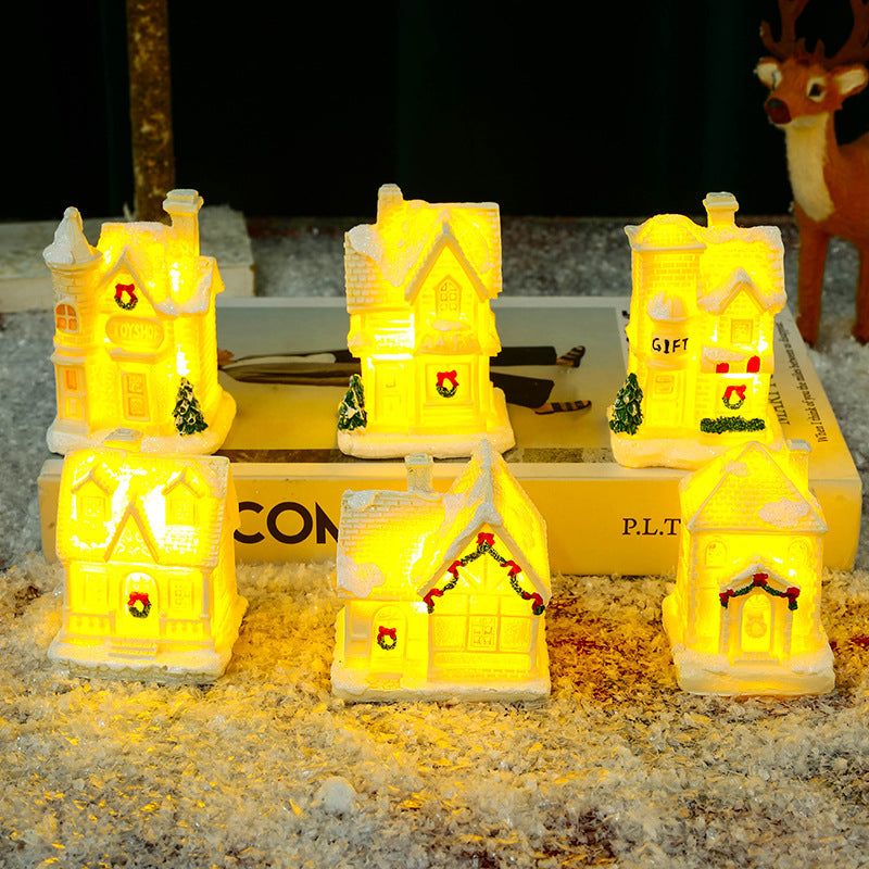 Illuminated Christmas village house with festive decoration