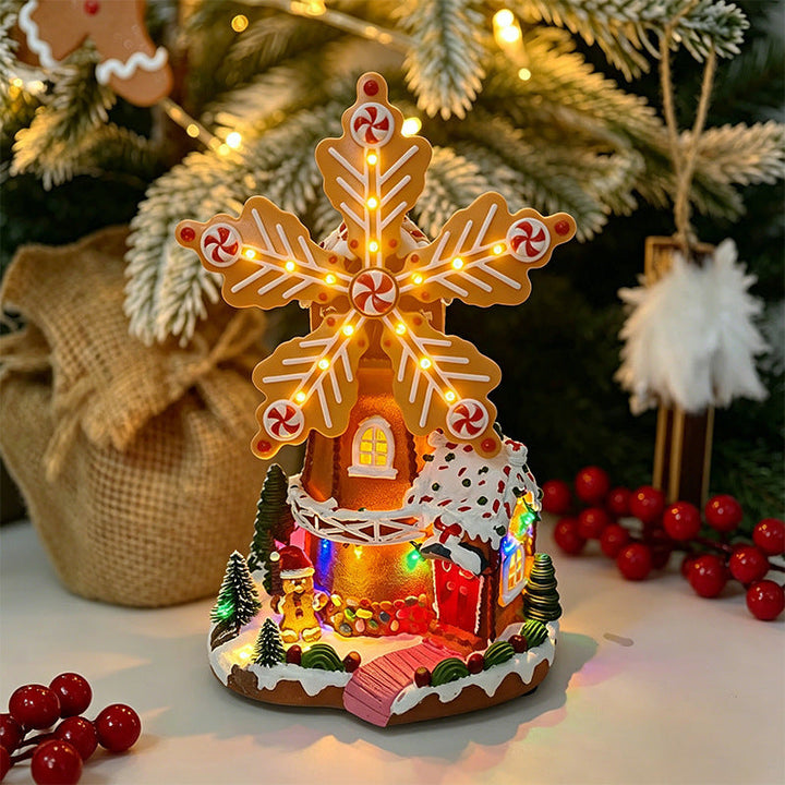 Illuminated Christmas village decoration with moving figures