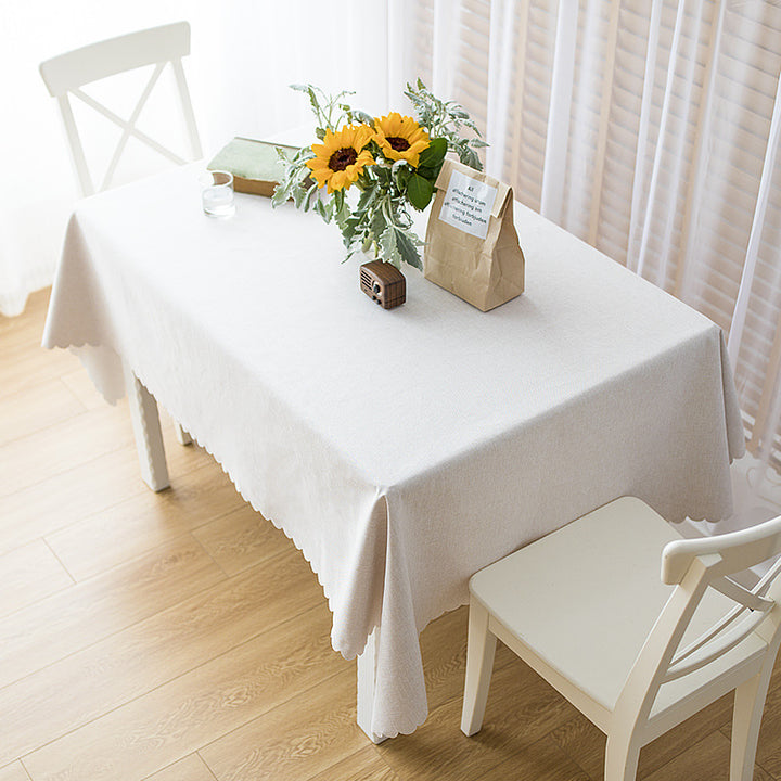 Rectangular tablecloth in linen look with wavy arc edge