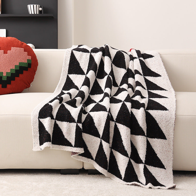 Coarsely woven decorative blanket with geometric jacquard pattern and soft bouclé