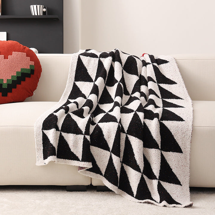 Coarsely woven decorative blanket with geometric jacquard pattern and soft bouclé