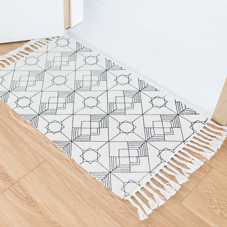 Flat-woven entrance runner made of cotton blend with geometric tile pattern and fringes