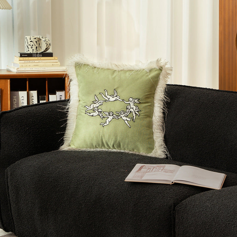 Luxurious decorative velvet cushion with angel embroidery and faux fur trim