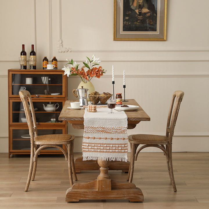 Woven cotton table runner with textured tufting and fringed border