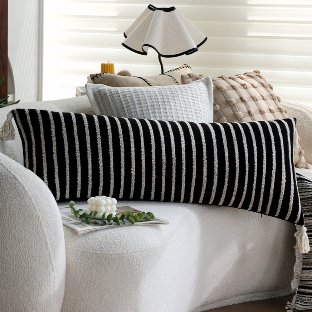 Woven home decor pillow cover with fine striped texture and hand-fringed edge