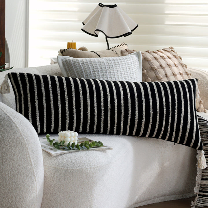 Woven home decor pillow cover with fine striped texture and hand-fringed edge