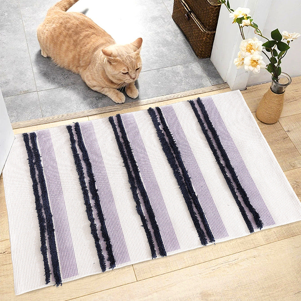 Cotton bath mat with textured stripes and fringes