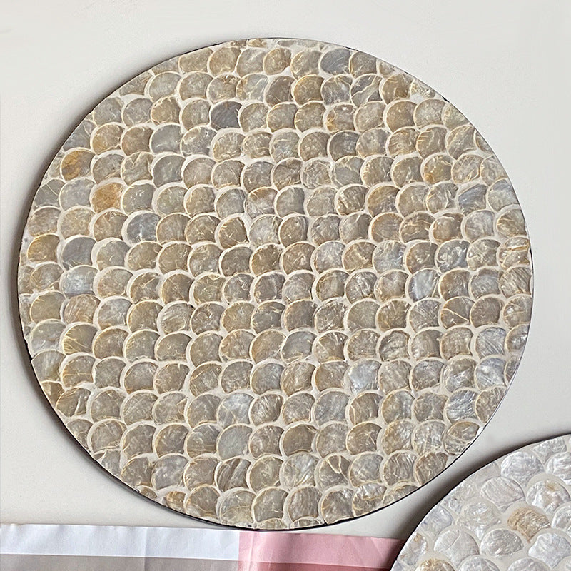 Round serving board made from noble shells