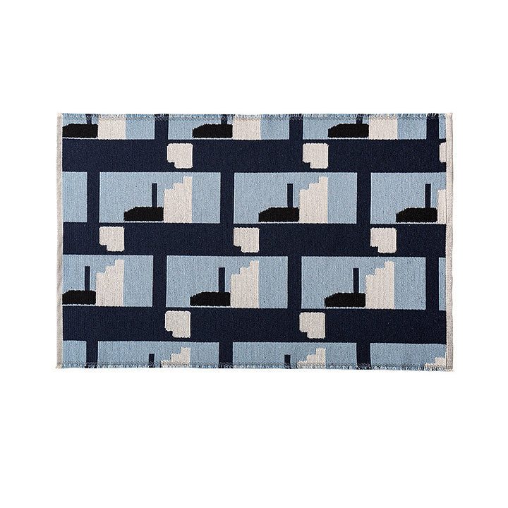 Modern geometric bathroom rug made of flat-woven cotton with non-slip backing