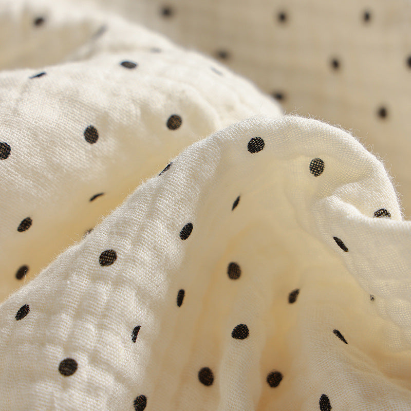 Long ruffled hem bolster lumbar cushion with fine dot pattern