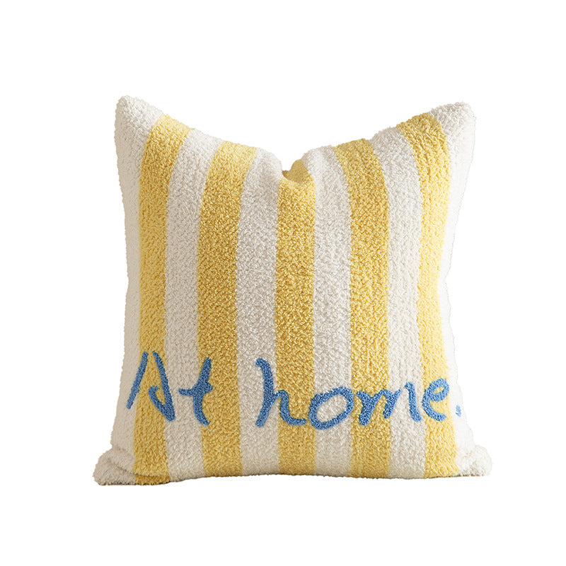 Striped bouclé decorative pillow with embroidered lettering and cuddly filling