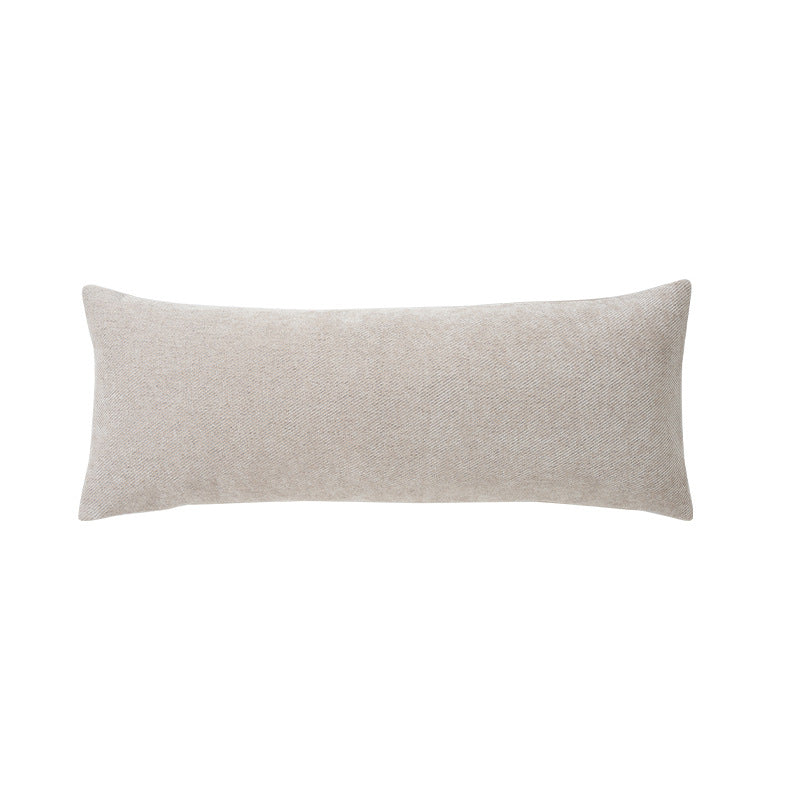Long rectangular lumbar and neck pillow with textured woven look and concealed zipper