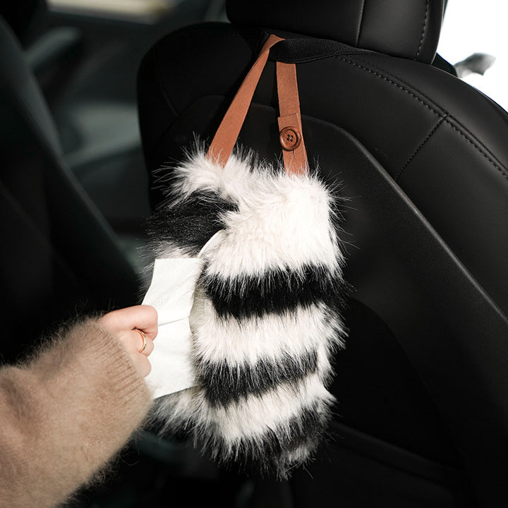 Handy tissue storage made of faux fur with leather handle and pompom