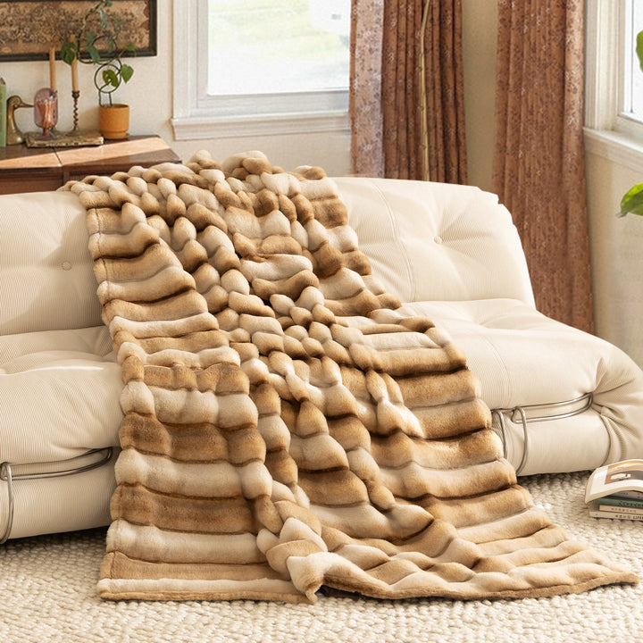Luxurious cozy faux fur blanket with quilted relief pattern