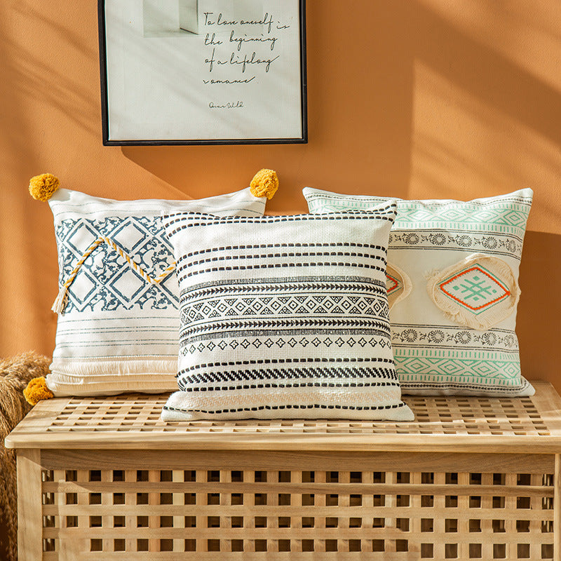Woven decorative cushion cover in ethnic mix with braided ribbon and tassels